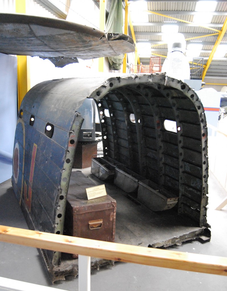 Newark Air Museum: Lancaster Corner – (above) wing-tip of Lancaster bomber, R5726; (foreground) fuselage fragment of Lancaster Mk I, W4964